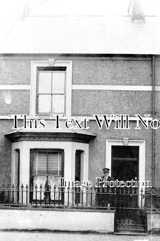 WL 596 - Man Outside House, Carnarvon, Wales c1909